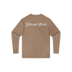 Tan long sleeve t-shirt, back view, with hilary duff script logo printed across the upper back