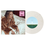Hilary Duff Roommates 7-inch vinyl single, cream marbled record beside cover art of her in a fur coat on a bed