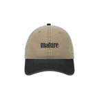 Tan dad hat with black brim and mature wordmark embroidered on front panel, front view