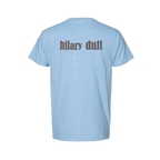 Light blue t-shirt, back view, with hilary duff in brown vintage-style lettering across the upper back