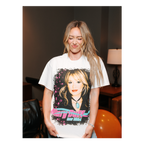 Model wearing a cream vintage-style Hilary Duff Tour 2004 t-shirt, close-up lifestyle shot of the front graphic