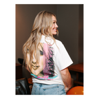 Model wearing a cream Hilary Duff Tour 2004 t-shirt, back view showing the photo graphic and logo lettering