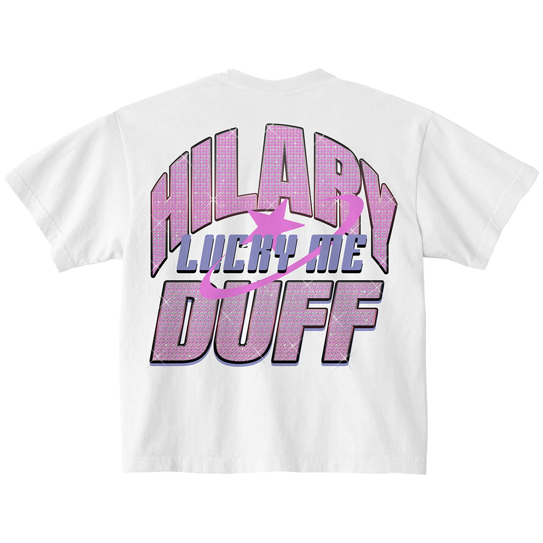 White t-shirt, back view close-up of a sparkly pink Hilary Lucky Me Duff glitter graphic